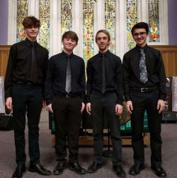 the members of Spencer's barbershop quartet